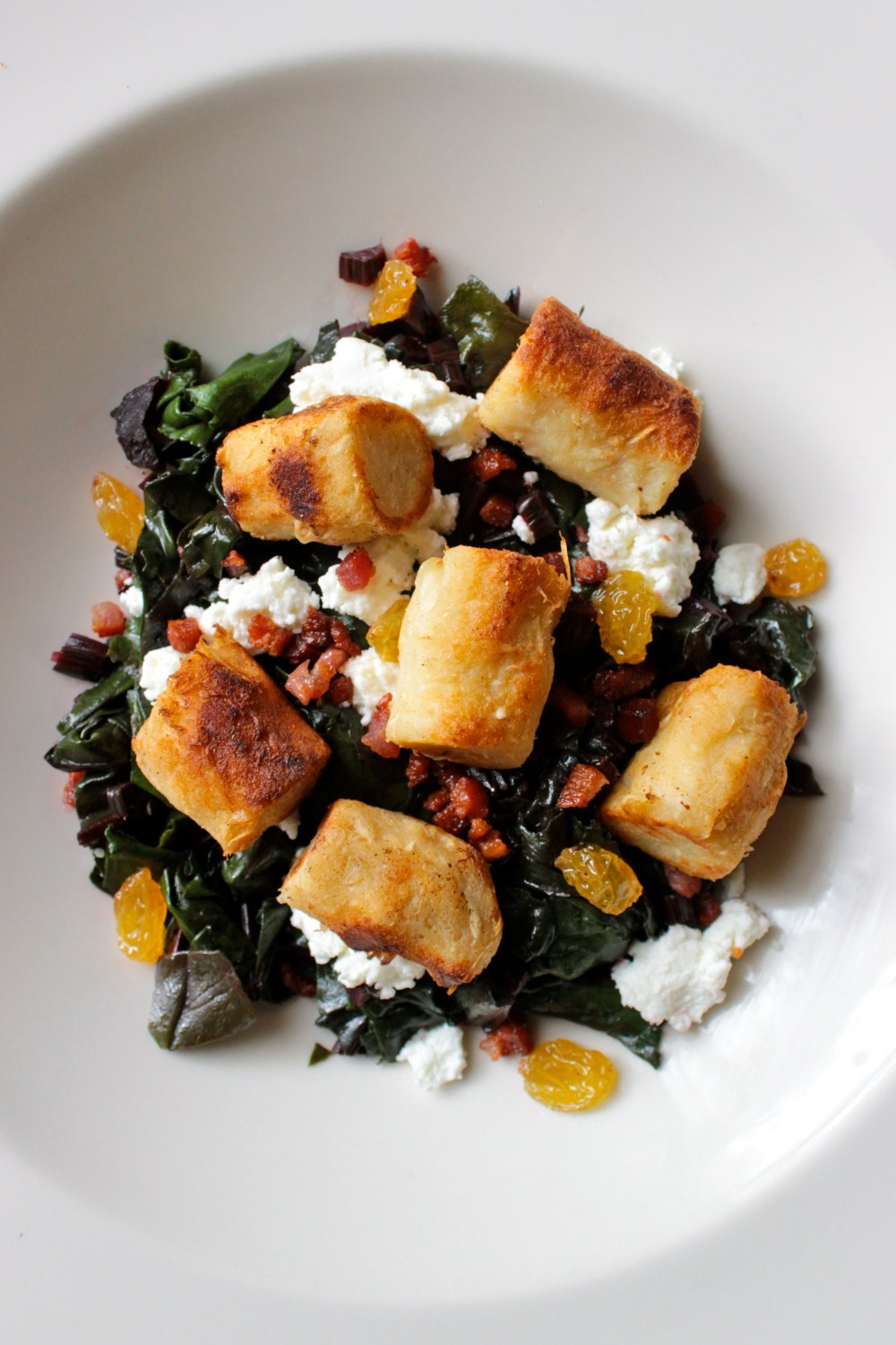 Crispy Horseradish Gnocchi with Beet Greens, Goat Cheese and Pancetta