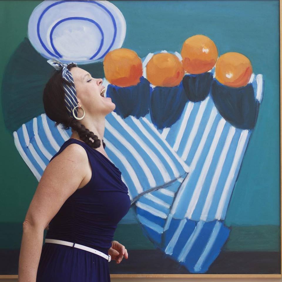 Erin K Orr cooks at the Frieight. Painting by Bob Nunnley.Photo by Rachael Shane 